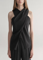 woman wearing a dark grey top and matching pants 