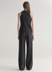 woman wearing a dark grey top and matching pants 