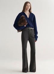 woman wearing navy blue sweater and black denim jeans