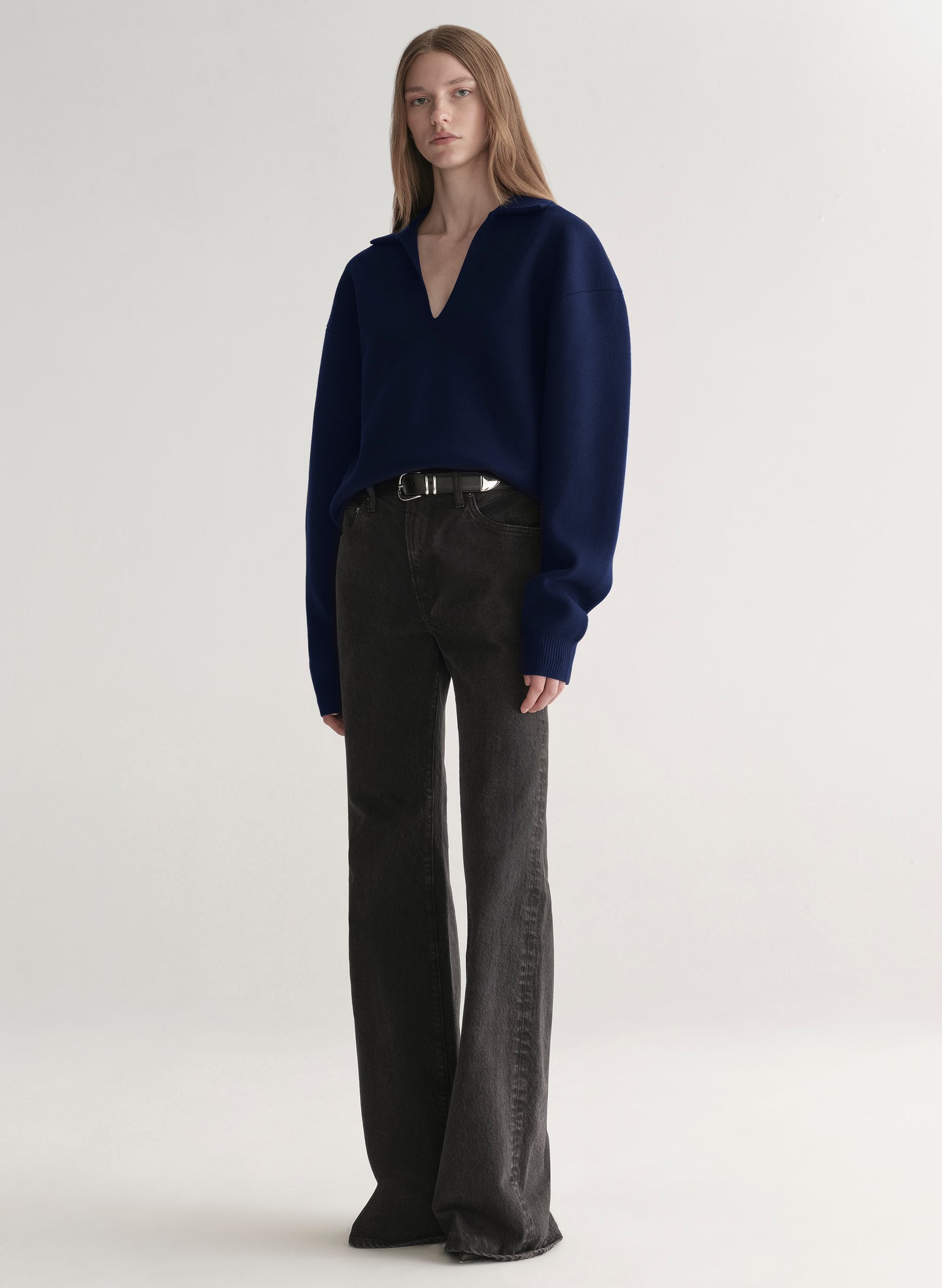 woman wearing navy blue sweater and black denim jeans