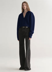 woman wearing navy blue sweater and black denim jeans