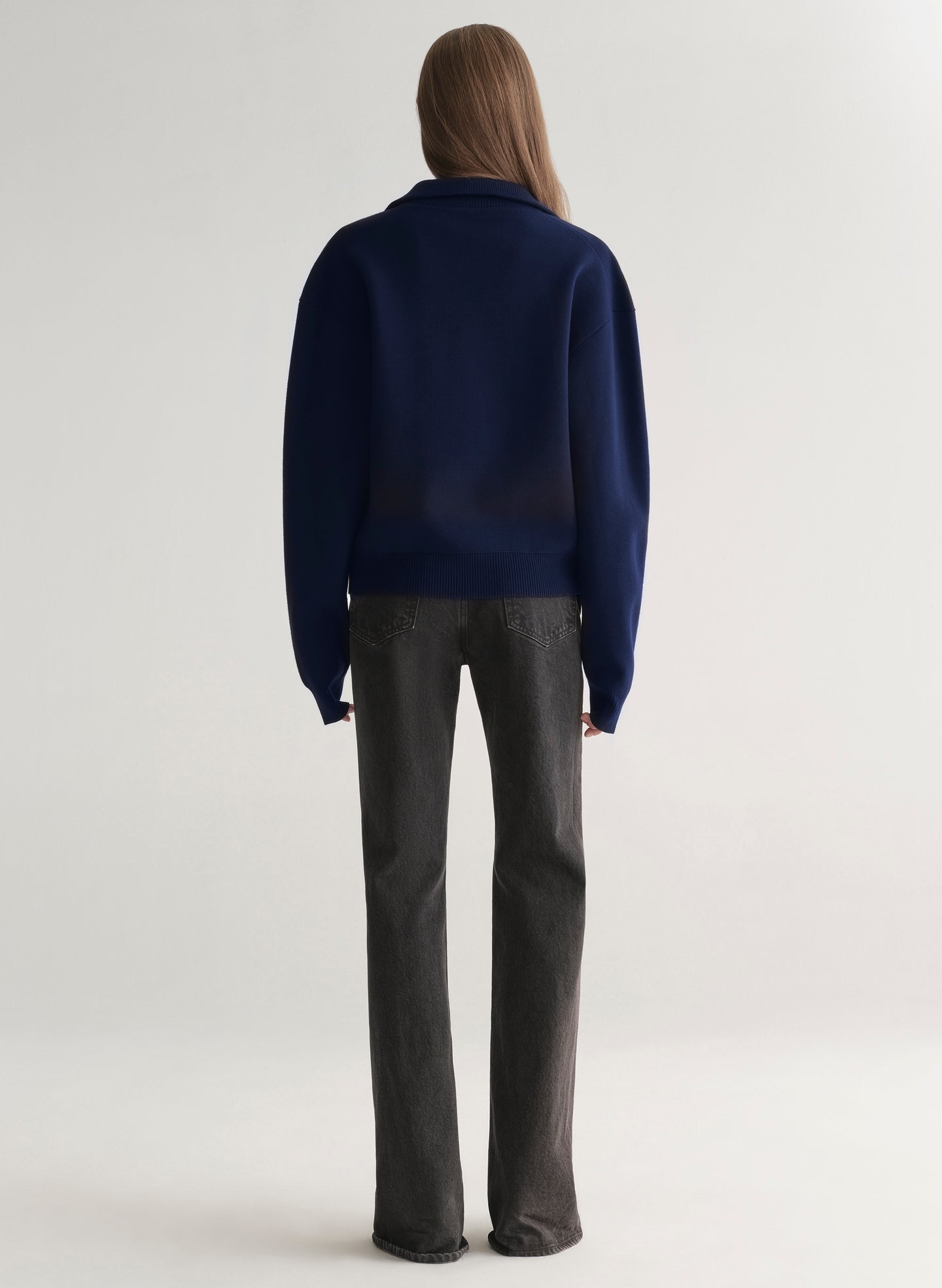 woman wearing navy blue sweater and black denim jeans