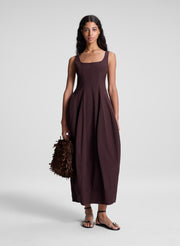 woman wearing brown midi dress