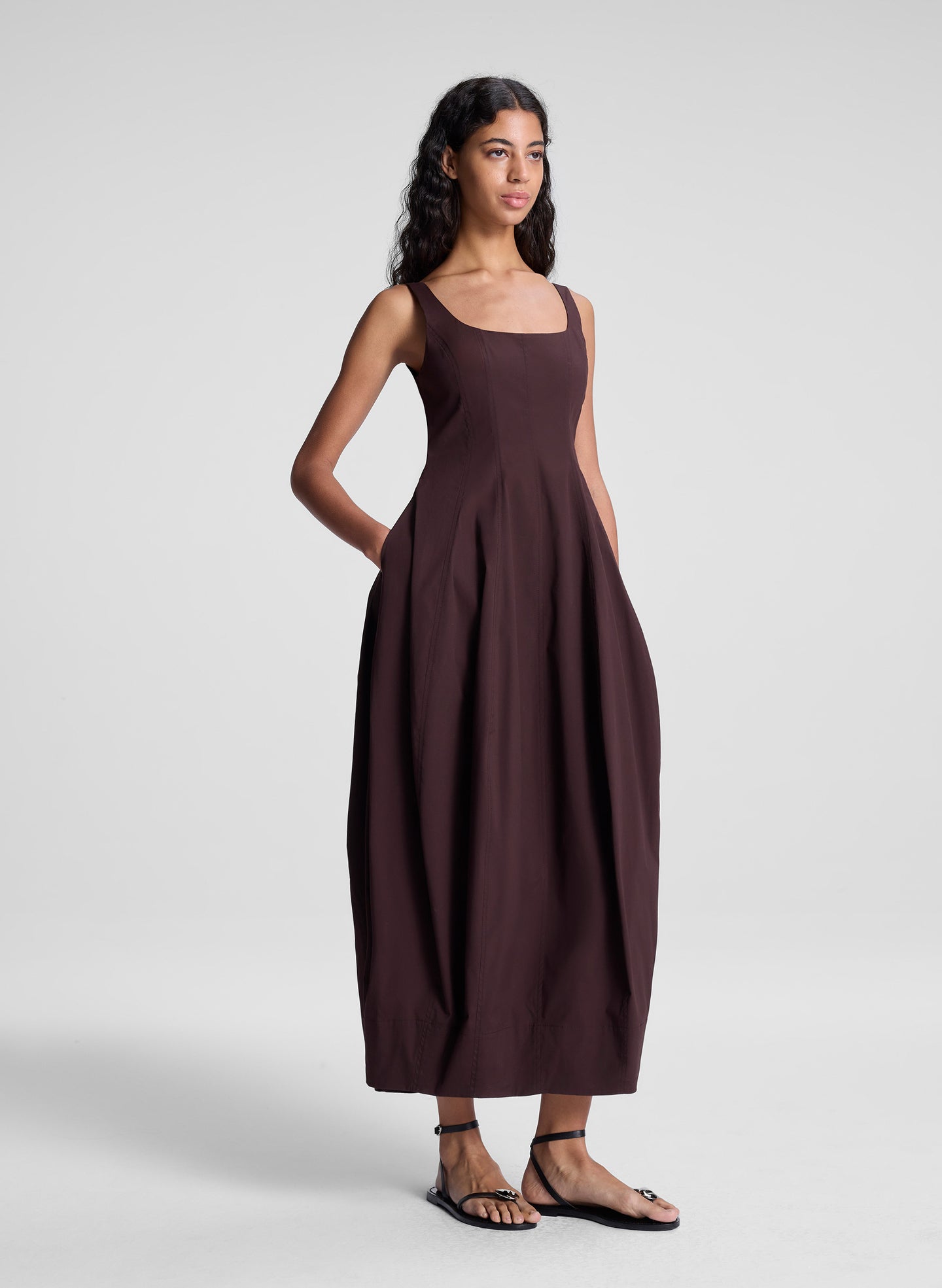 woman wearing brown midi dress