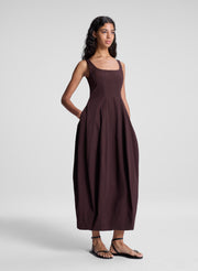 woman wearing brown midi dress
