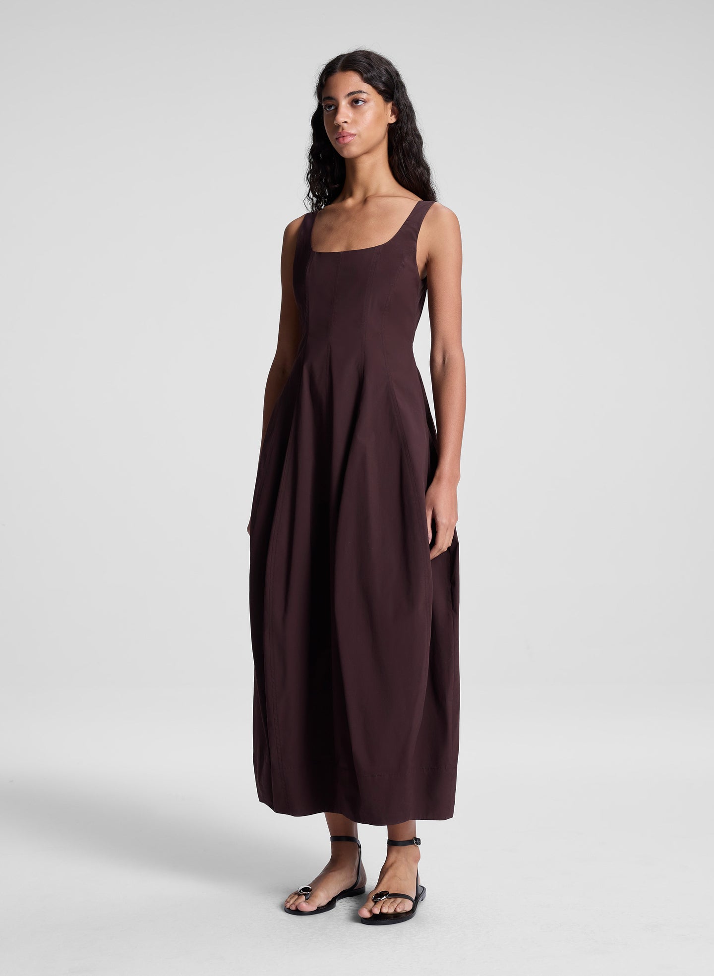 woman wearing brown midi dress