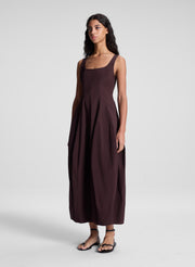 woman wearing brown midi dress