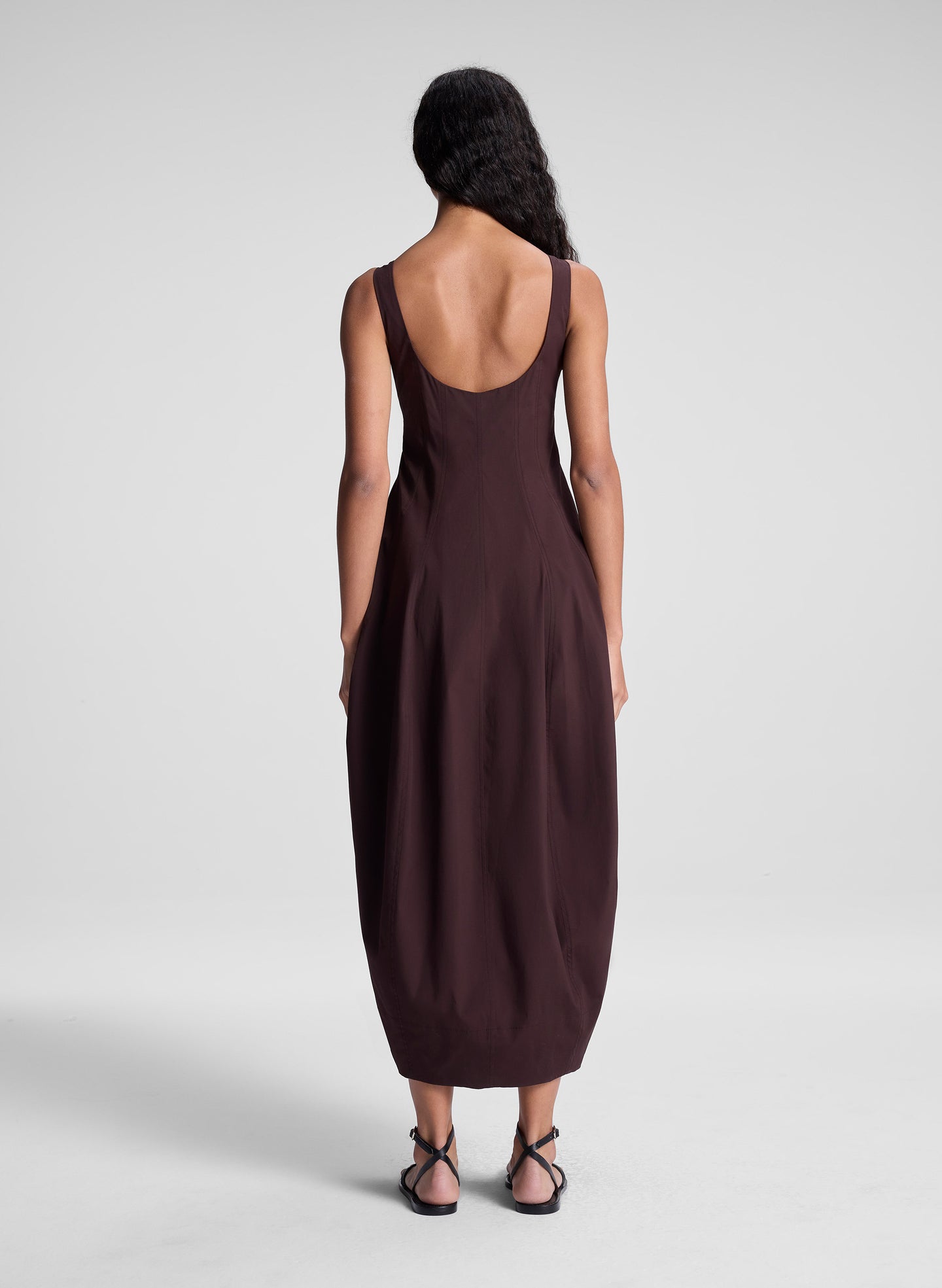 woman wearing brown midi dress