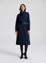 woman wearing navy blue dress with black belt 