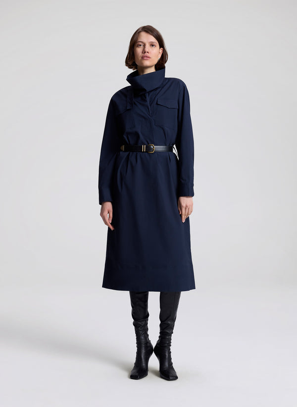 woman wearing navy blue dress with black belt 