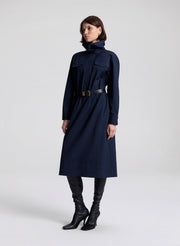 woman wearing navy blue dress with black belt 