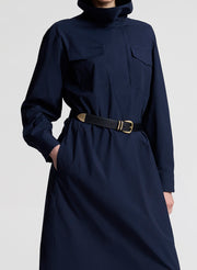 woman wearing navy blue dress with black belt 