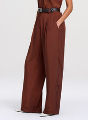 Browntop with wide-leg pants on a white background