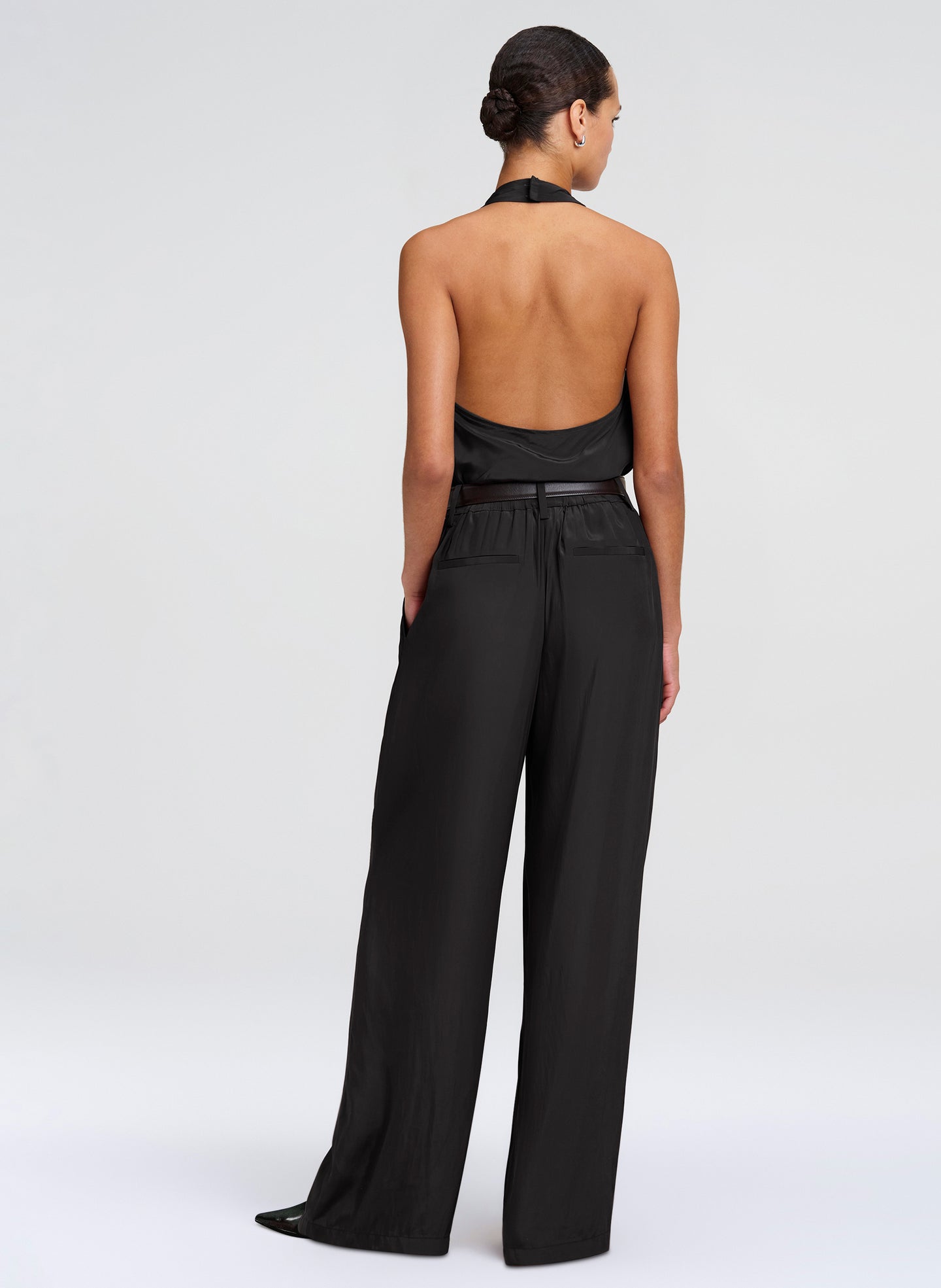 woman in halter top and black pants