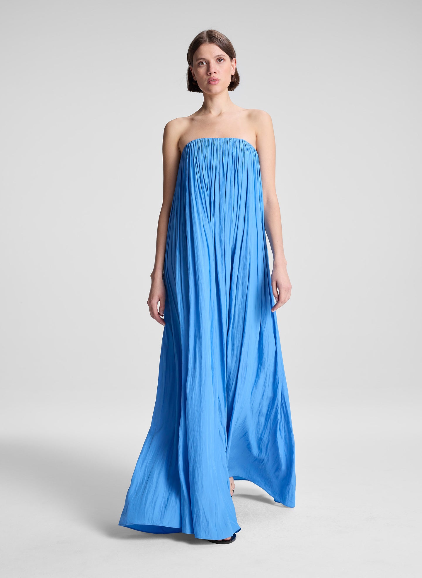 woman wearing blue strapless gown