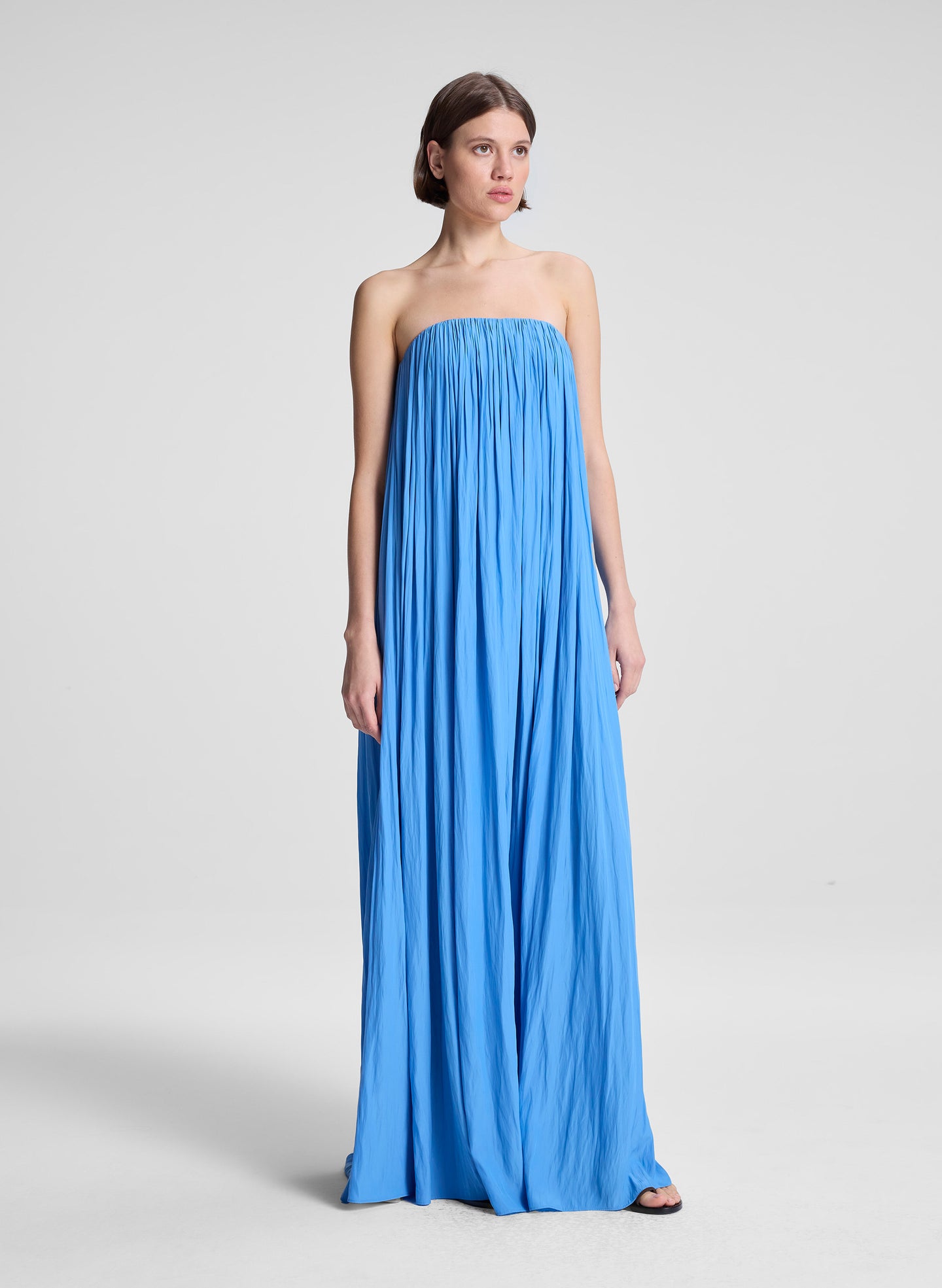 woman wearing blue strapless gown