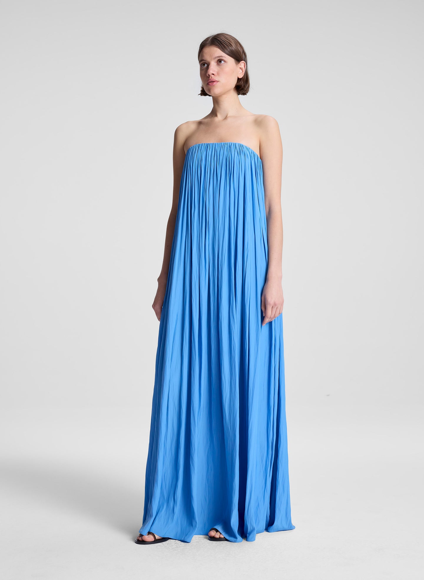woman wearing blue strapless gown