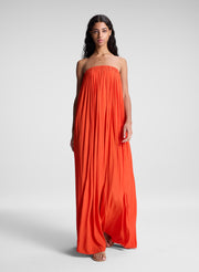 woman wearing orange strapless gown