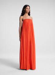 woman wearing orange strapless gown