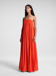 woman wearing orange strapless gown