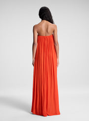 woman wearing orange strapless gown