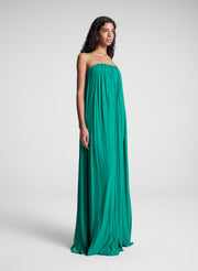 Woman wearing green strapless maxi dress