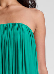 Woman wearing green strapless maxi dress