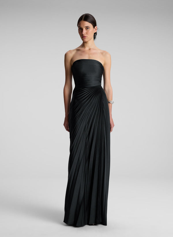 woman wearing black strapless maxi dress