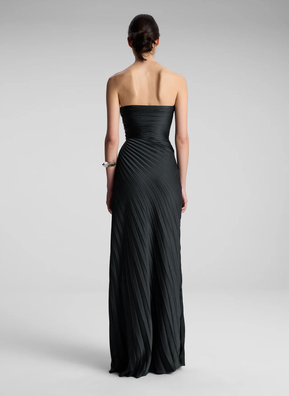 woman wearing black strapless maxi dress