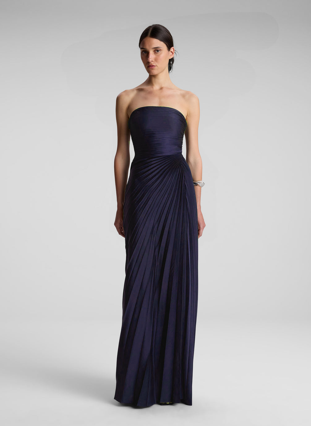 woman wearing navy blue strapless maxi dress