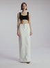 video view of woman wearing black cropped knit tank and white maxi skirt