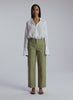 video view of woman wearing white button down shirt and olive pants