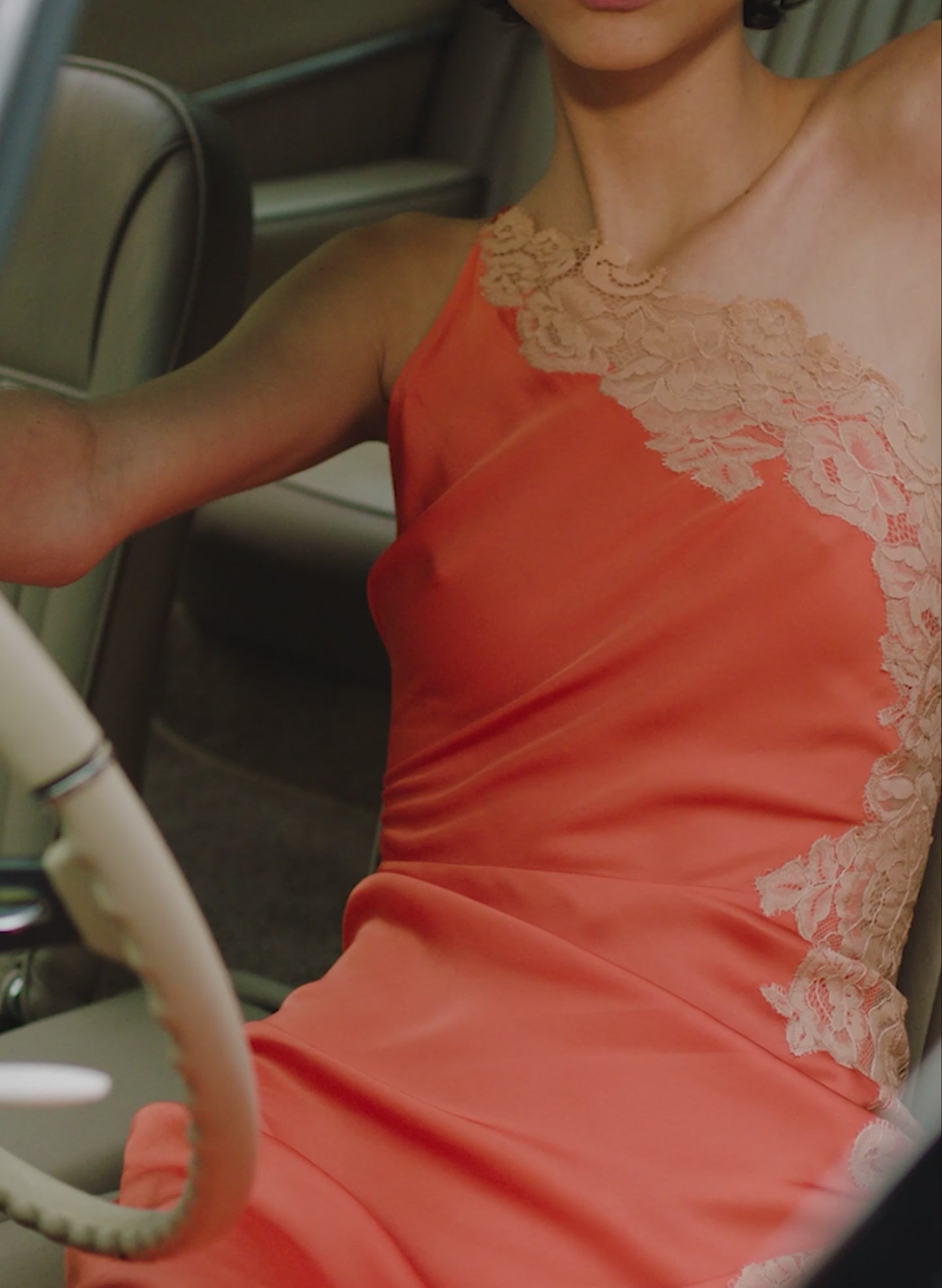 video of a woman in an orange dress