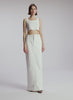 video view of woman wearing white cropped rib tank and white maxi skirt