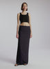 video view of woman wearing black cropped rib tank top with black maxi skirt