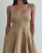 video on woman in sand color Nina Dress