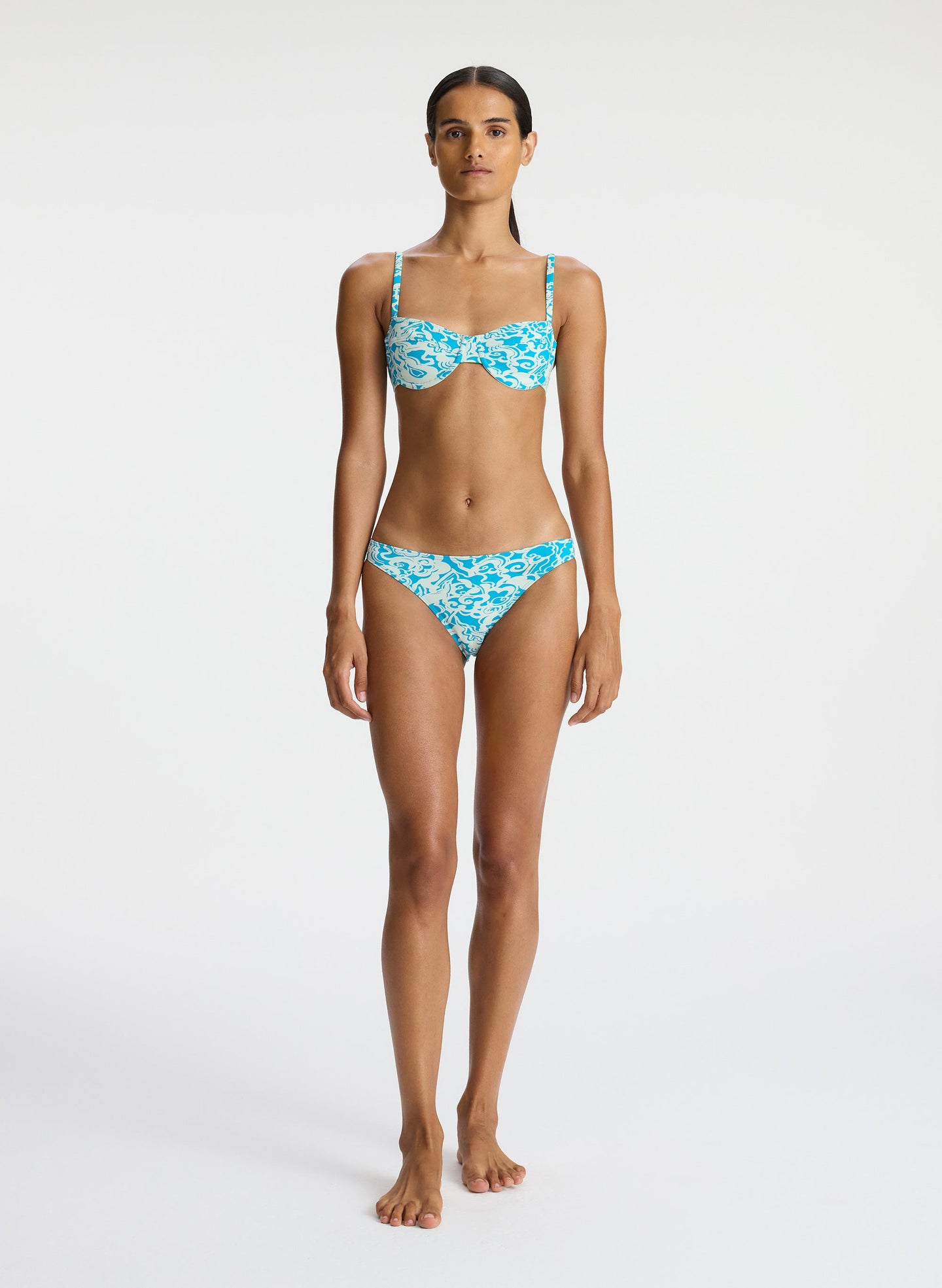 front view of woman wearing aqua printed bikini set
