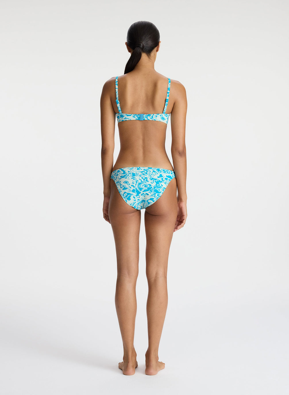 back view of woman wearing aqua printed bikini set