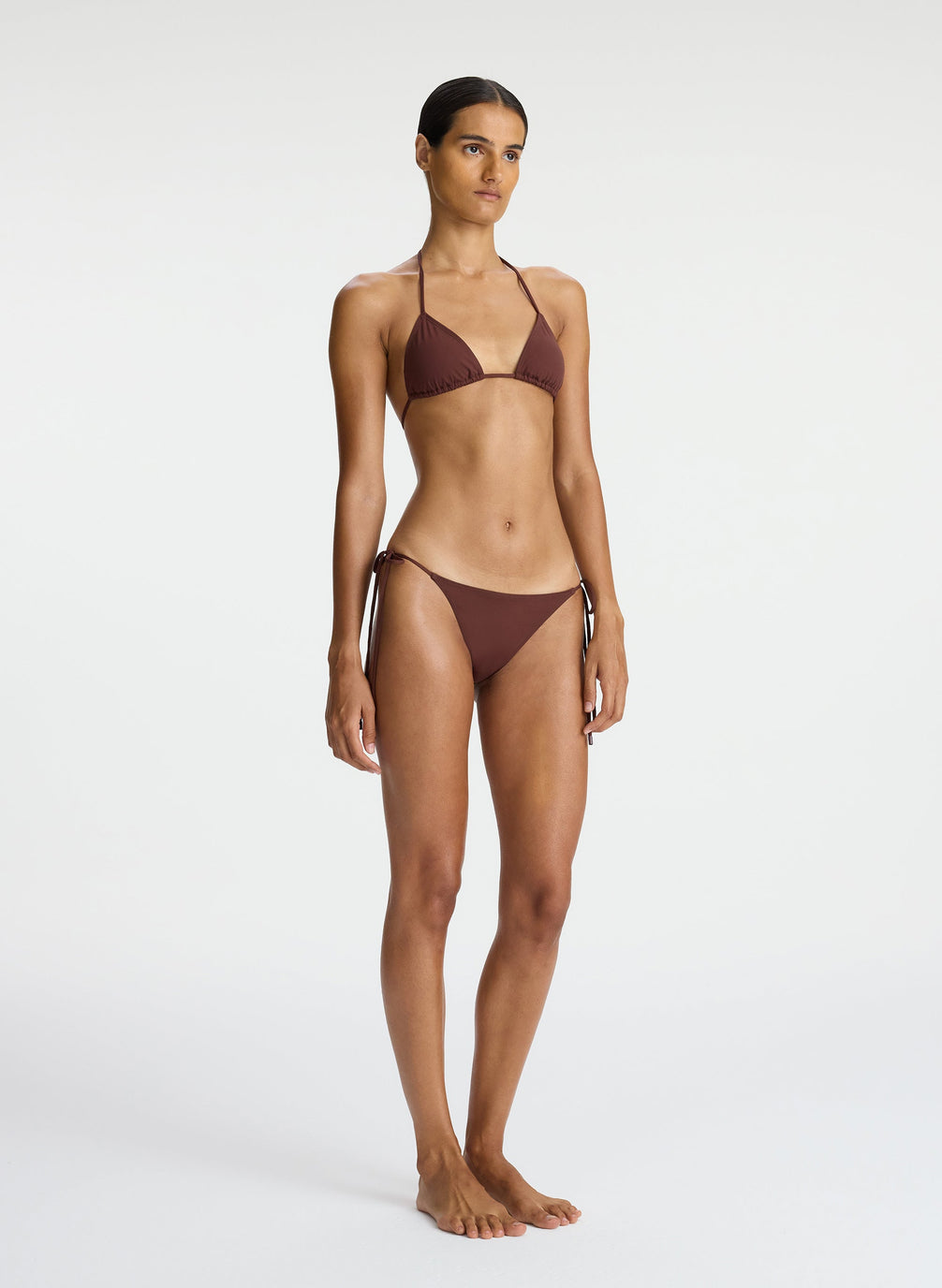 side view of woman wearing brown bikini set