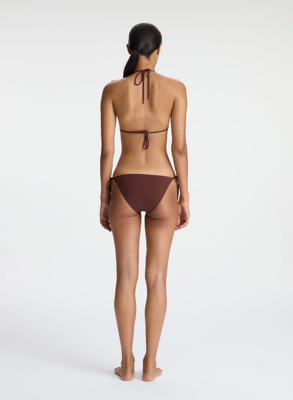 back view of woman wearing brown bikini set