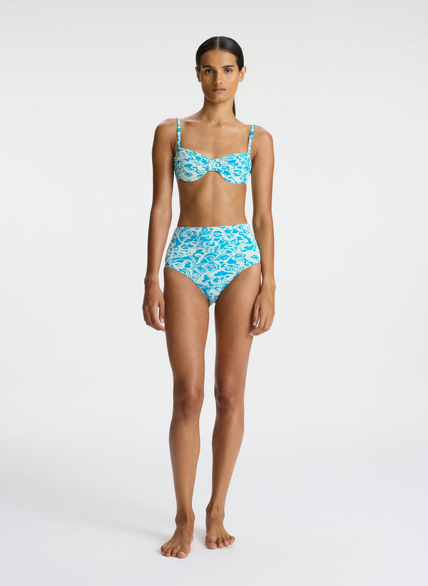 front view of woman wearing aqua print bikini set