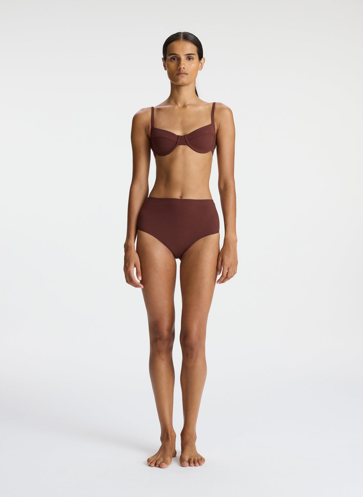front view of woman wearing brown bikini set