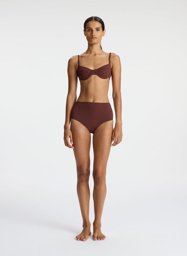 front view of woman wearing brown bikini set