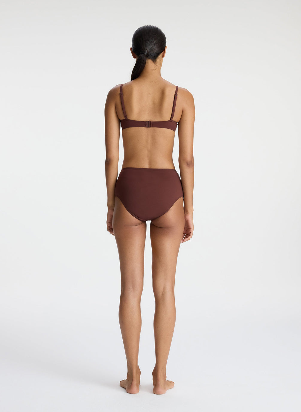 back view of woman wearing brown bikini set